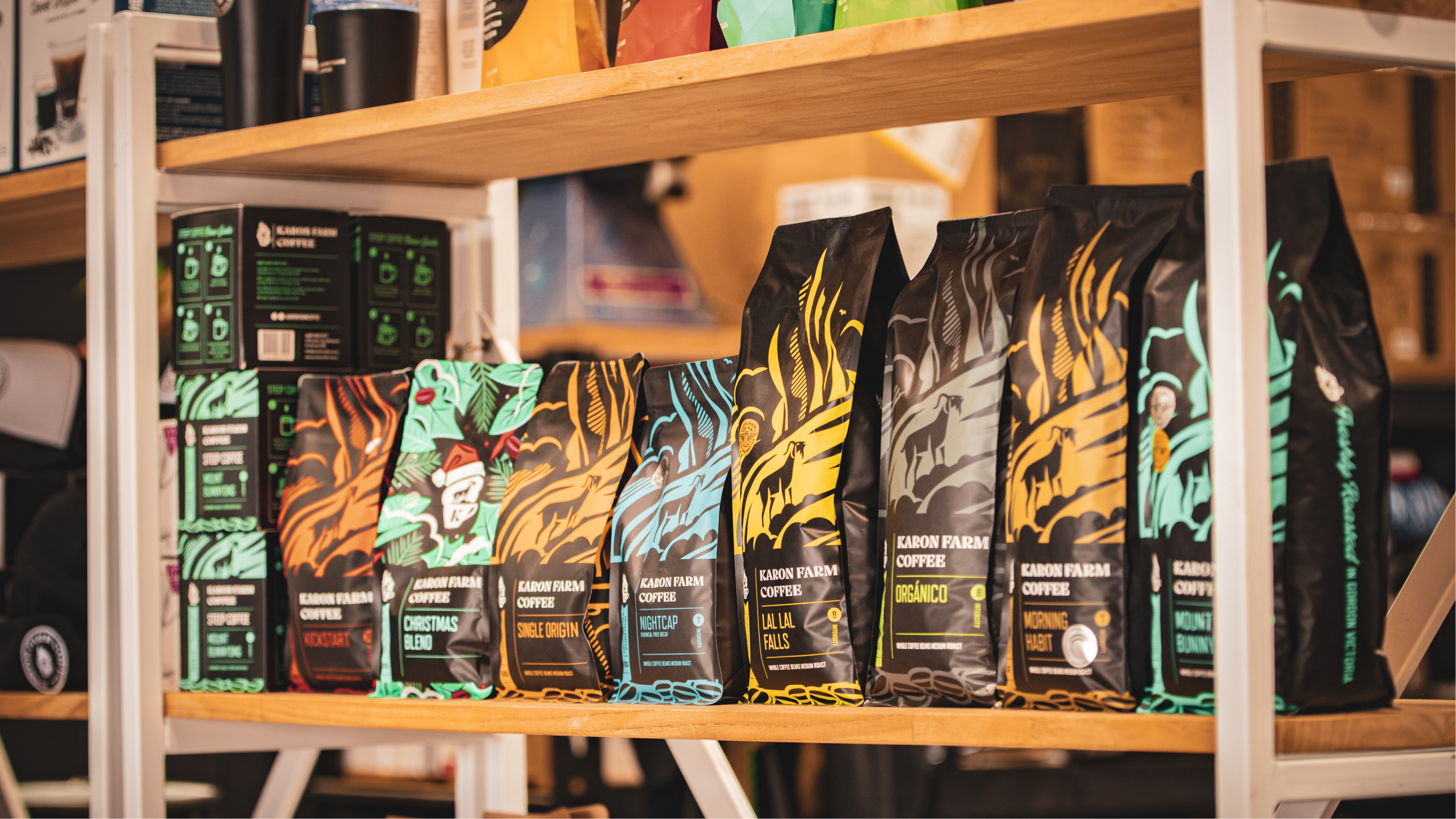 Shelf with various coffee bags in different designs and colors