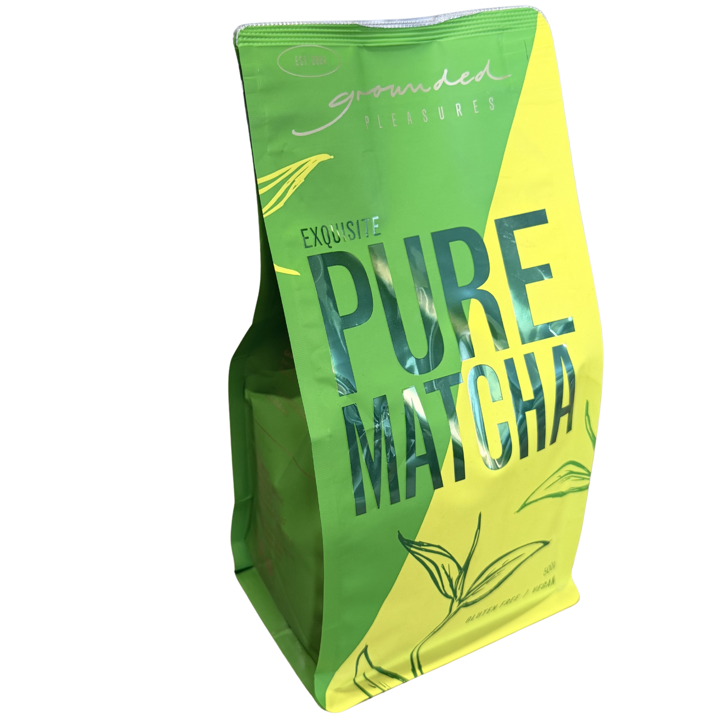 Green and yellow package of pure matcha on a white background