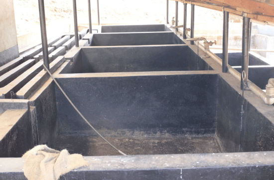 Concrete fermentation and soaking tanks at Kiamugumo Coffee Factory, Kirinyaga, Kenya