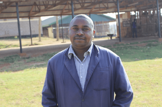 A staff member on site at Kiamugumo Coffee Factory, Kirinyaga, Kenya