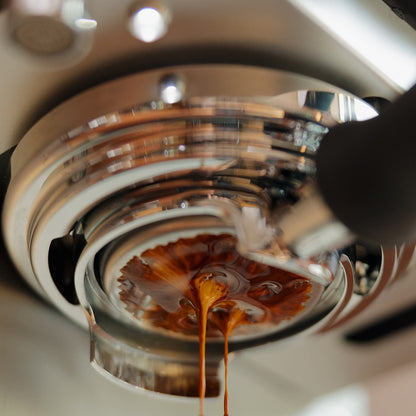 Espresso pouring from portafilter on La Marzocco Micra
