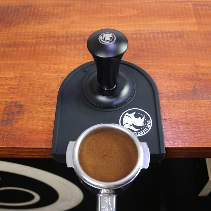 Rhino self-levelling tamper tamping a 58mm portafilter basket